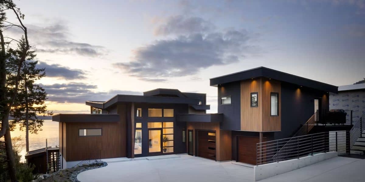 Modern custom home exterior by White Wolf Homes in Victoria BC at sunset.
