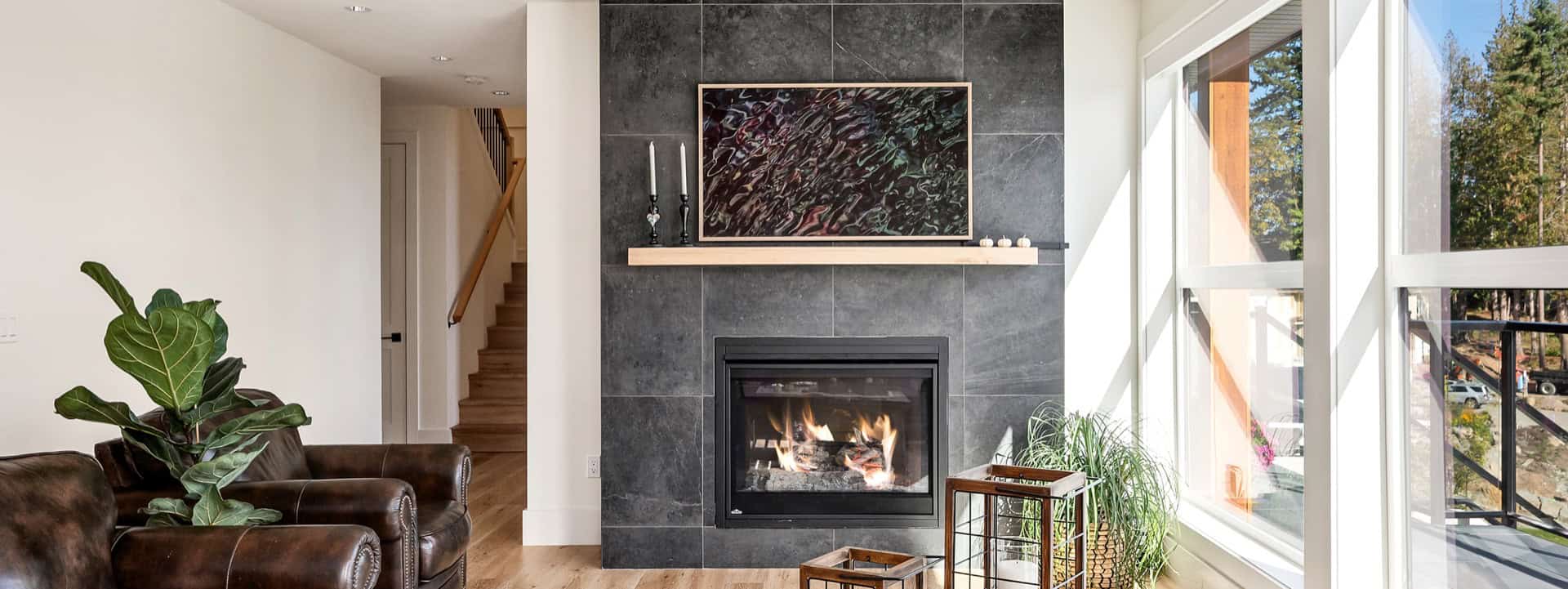 Cozy Langford living room with modern fireplace and large windows.