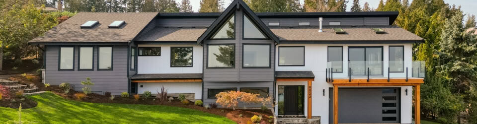 Victoria BC custom home exterior by White Wolf Homes with modern design and large windows.