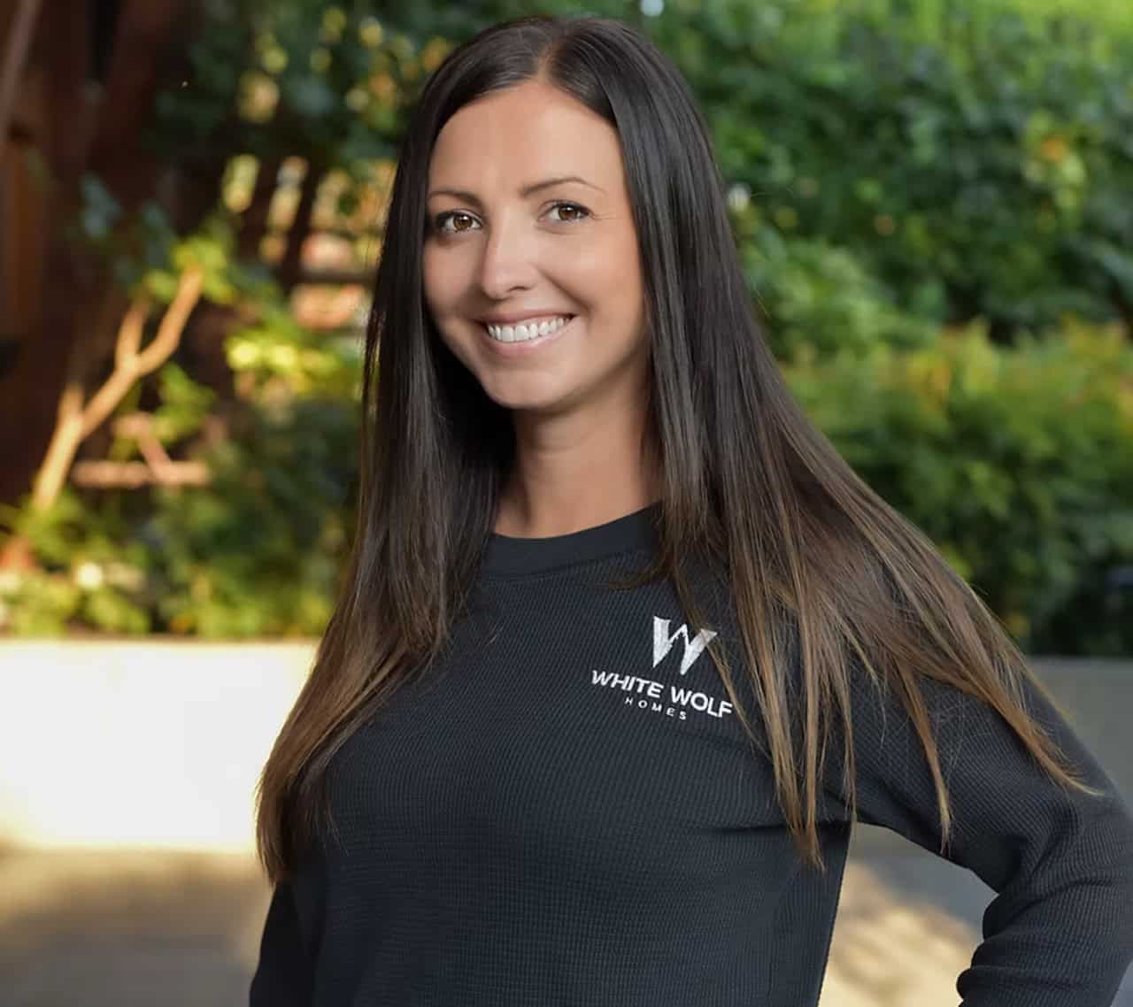 Portrait of a smiling team member wearing White Wolf Homes apparel for Victoria BC custom homes.
