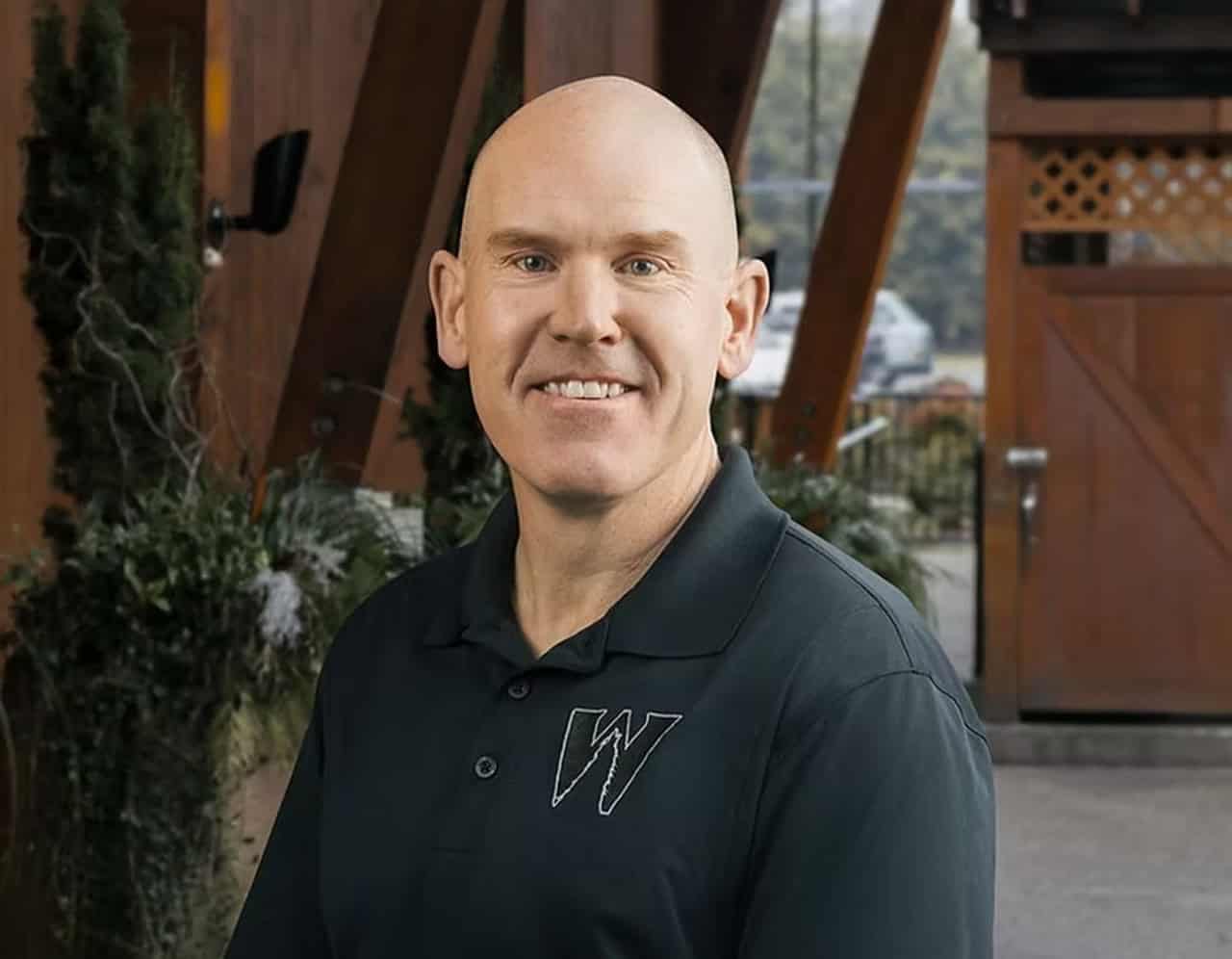 Team member at White Wolf Homes in Victoria BC with warm smile.