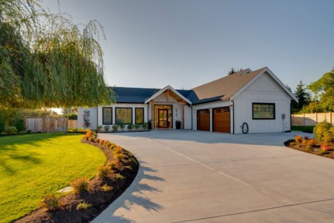 Victoria BC custom home exterior by White Wolf Homes, Willowmere residence with curved driveway.