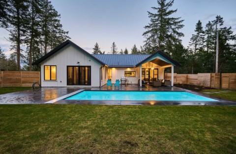 White Wolf Homes: modern Victoria BC custom home with pool and serene backyard.