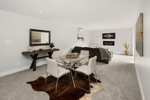 Modern open-concept living and dining area in a Victoria BC home.