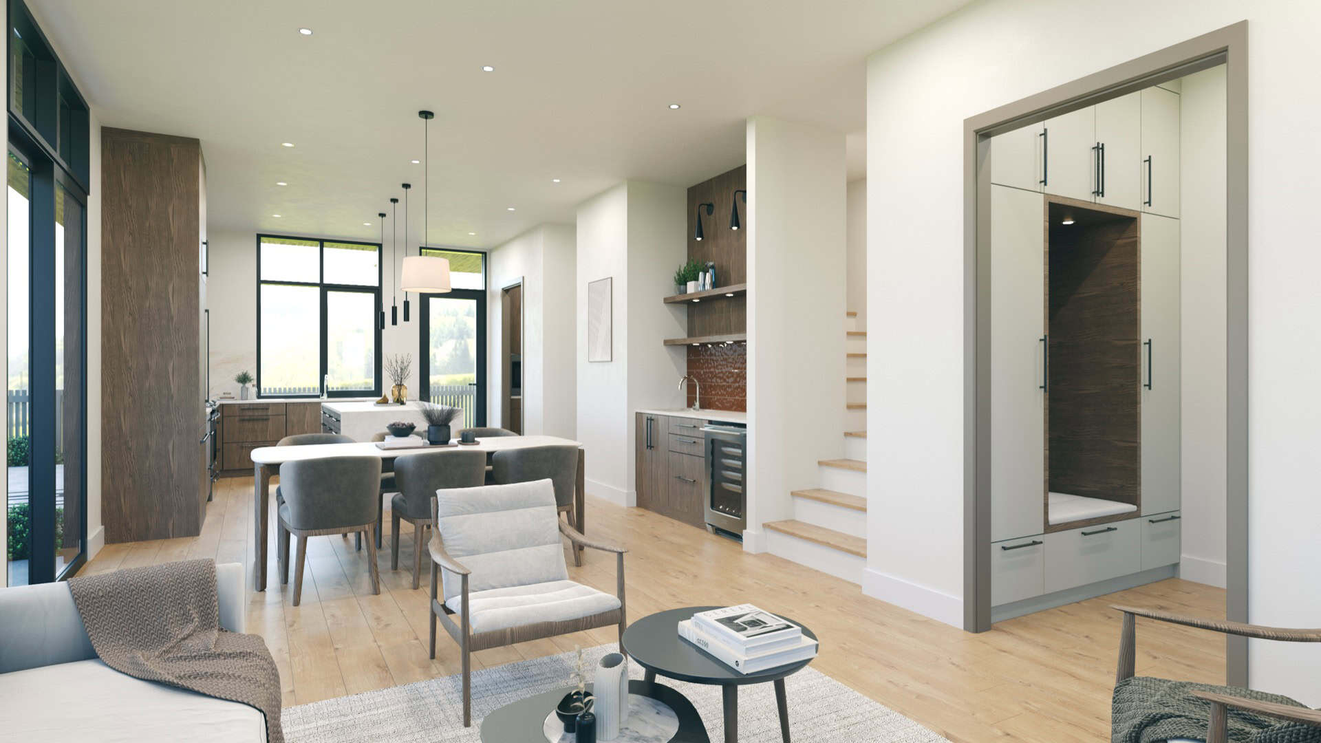 Interior view of a modern open-concept kitchen and living area with light wood floors and large clerestory windows.