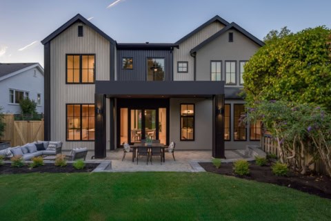 Victoria BC custom home by White Wolf Homes with modern grey siding and large windows.